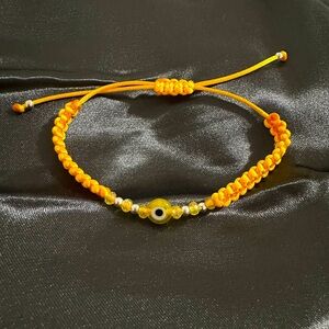 Yellow Evil eye handmade thread bracelet